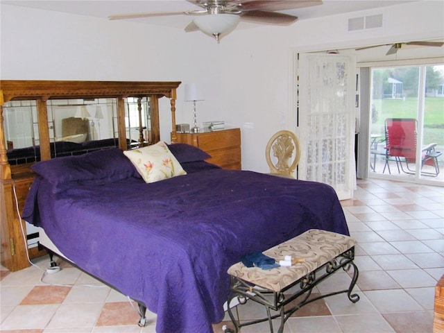 tiled bedroom with access to outside and ceiling fan