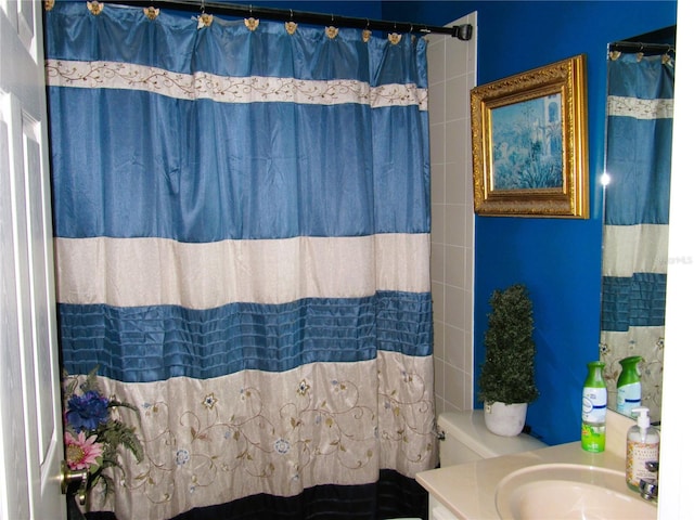 bathroom with vanity, a shower with curtain, and toilet