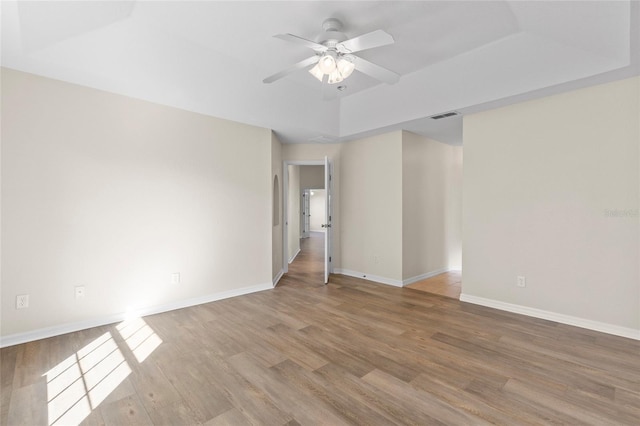 spare room with ceiling fan and light hardwood / wood-style flooring