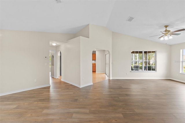 unfurnished living room with vaulted ceiling, ceiling fan, and light hardwood / wood-style flooring