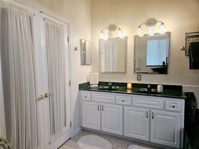 bathroom with vanity and tile patterned flooring