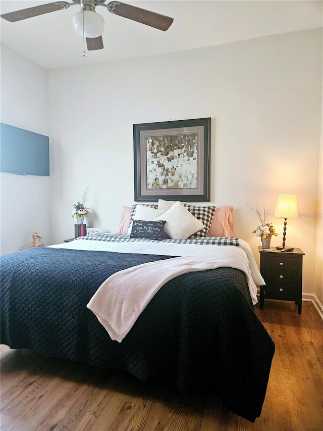 bedroom featuring ceiling fan and wood-type flooring