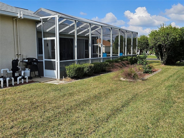 view of yard featuring glass enclosure