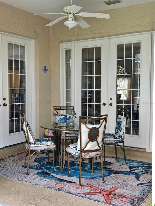 view of patio featuring french doors and ceiling fan