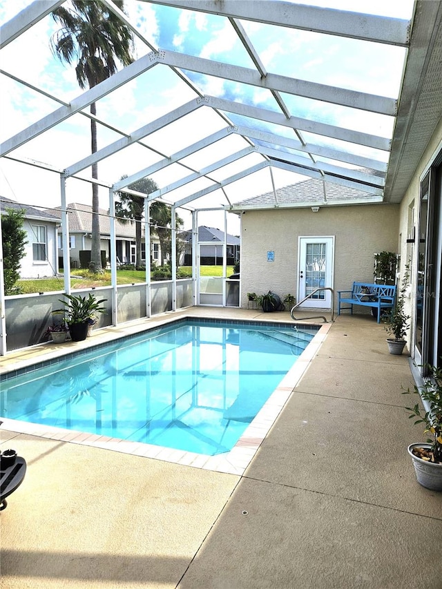 view of pool featuring a patio area and a lanai