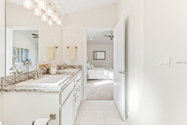 bathroom with ceiling fan, tile patterned floors, vanity, and vaulted ceiling