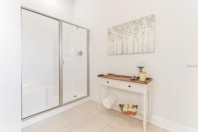 bathroom featuring a shower with door and tile patterned floors