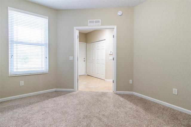 empty room with light carpet