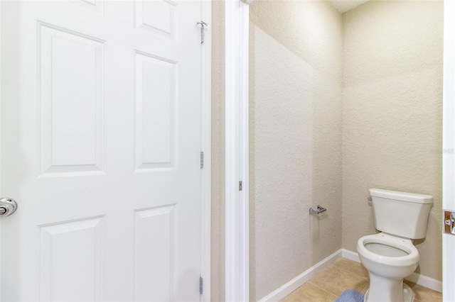 bathroom featuring tile patterned floors and toilet