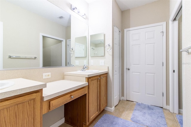 bathroom with vanity and tile patterned floors