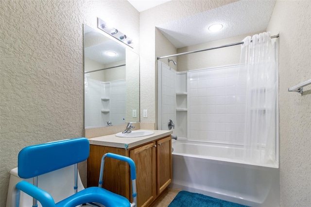 bathroom featuring vanity, shower / bath combo, and a textured ceiling