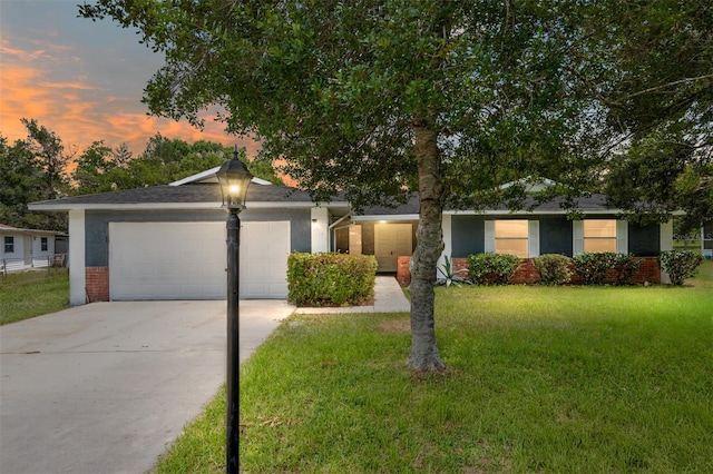 view of front facade featuring a yard and a garage