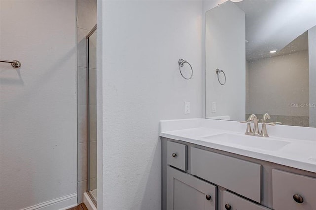 bathroom with vanity and walk in shower