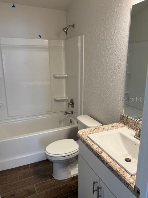 full bathroom with toilet, bathtub / shower combination, and vanity