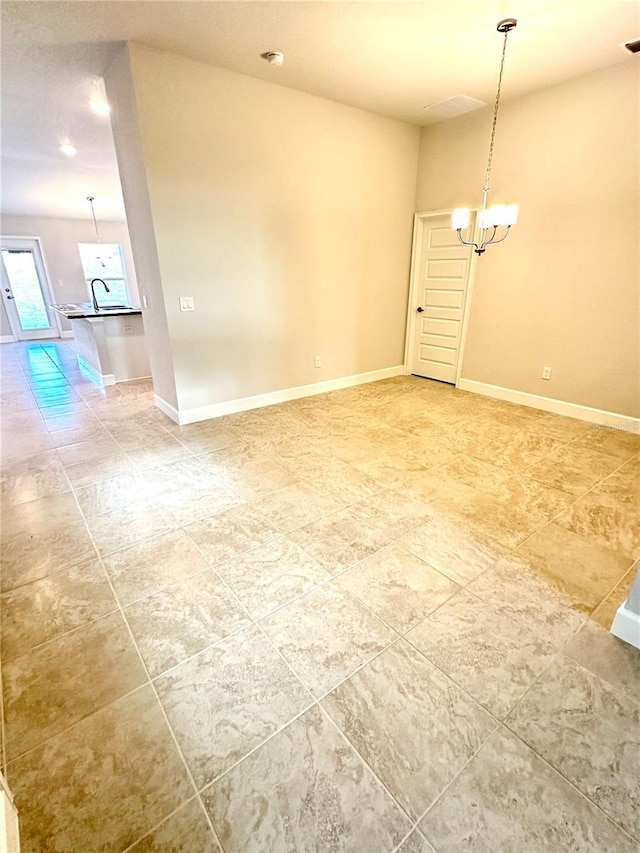 3127 NE 45th Ave, Ocala, FL 34470 - unfurnished room featuring light tile patterned floors, a notable chandelier, and baseboards
