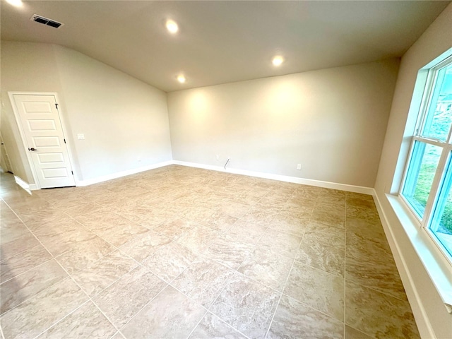 3127 NE 45th Ave, Ocala, FL 34470 - spare room featuring baseboards, vaulted ceiling, visible vents, and recessed lighting