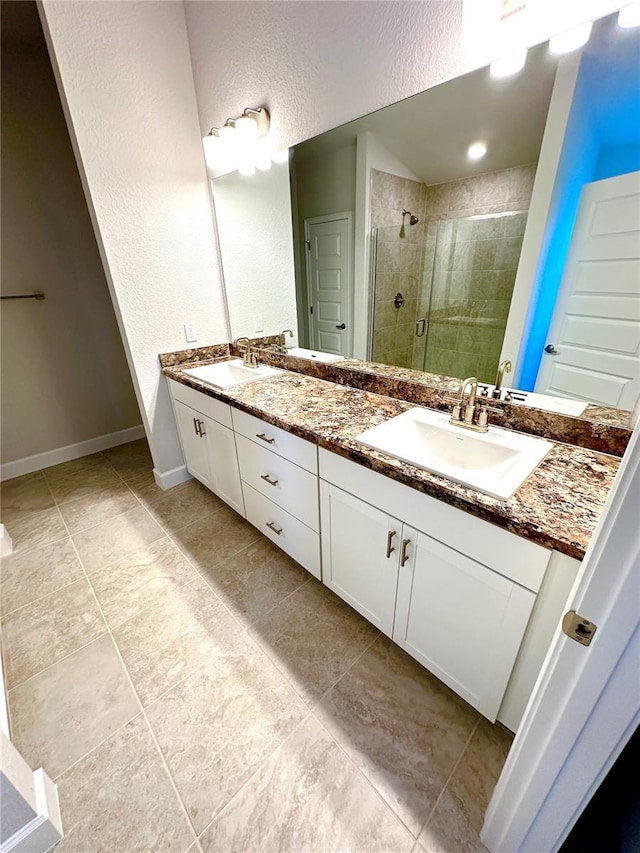 3127 NE 45th Ave, Ocala, FL 34470 - full bathroom featuring a stall shower, double vanity, a sink, and a textured wall