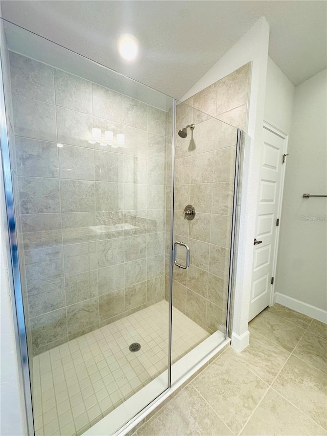 3127 NE 45th Ave, Ocala, FL 34470 - full bathroom with a shower stall, tile patterned flooring, and baseboards