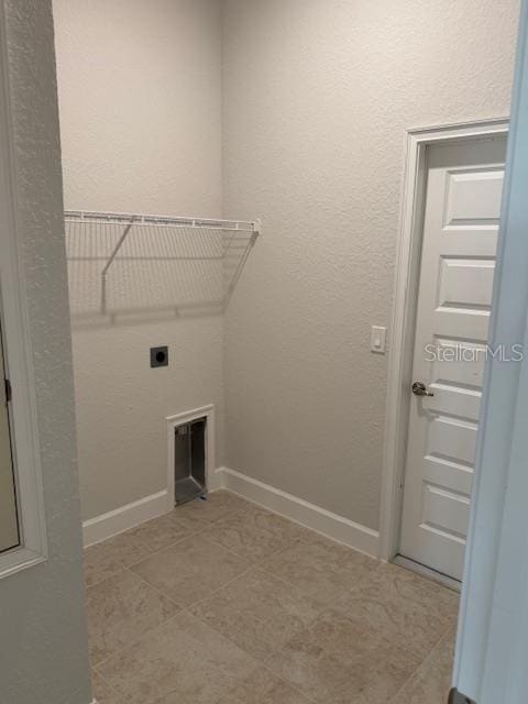 3127 NE 45th Ave, Ocala, FL 34470 - laundry room with electric dryer hookup, laundry area, and baseboards
