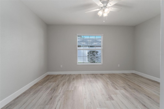 unfurnished room featuring light hardwood / wood-style flooring and ceiling fan