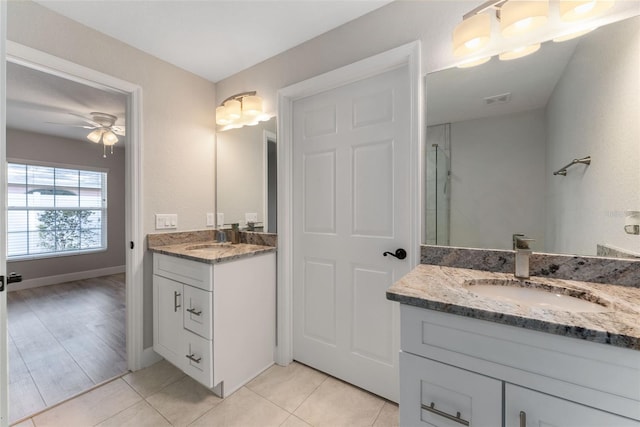 bathroom with vanity, ceiling fan, hardwood / wood-style flooring, and a shower with door