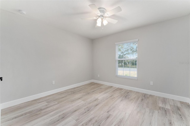 spare room featuring ceiling fan and light wood-type flooring