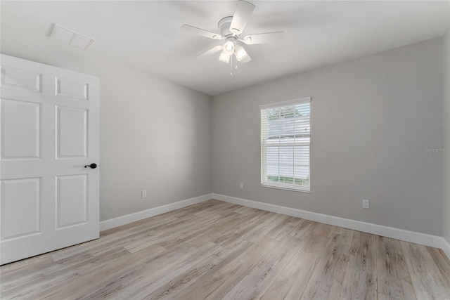 empty room featuring light hardwood / wood-style flooring and ceiling fan