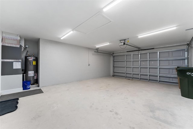 garage featuring a garage door opener and electric water heater