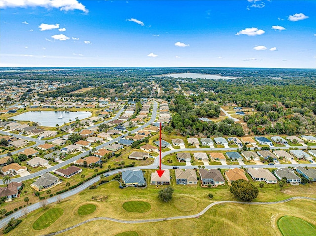 bird's eye view featuring a residential view and a water view