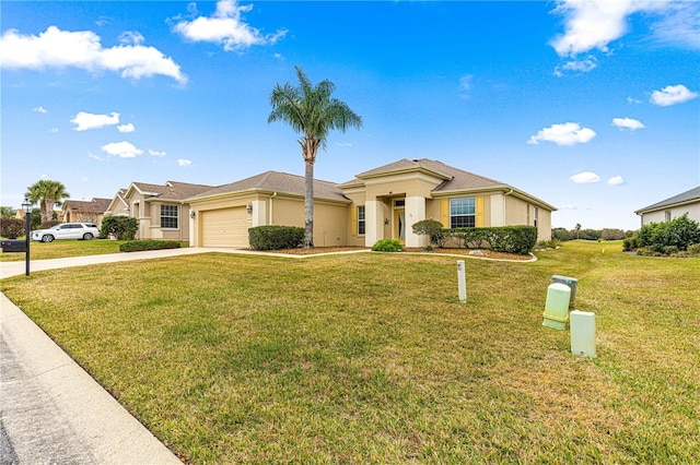 view of front of home featuring a garage, a front lawn, concrete driveway, and stucco siding