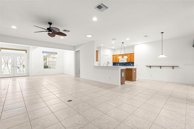 unfurnished living room featuring recessed lighting, visible vents, ceiling fan, and light tile patterned flooring