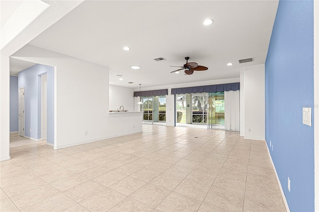 unfurnished living room featuring ceiling fan, recessed lighting, visible vents, and baseboards