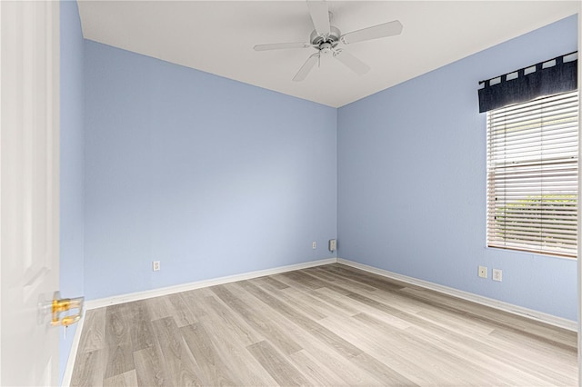 unfurnished room featuring a ceiling fan, light wood-type flooring, and baseboards