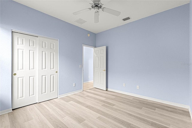 unfurnished bedroom featuring light wood-type flooring, visible vents, and baseboards