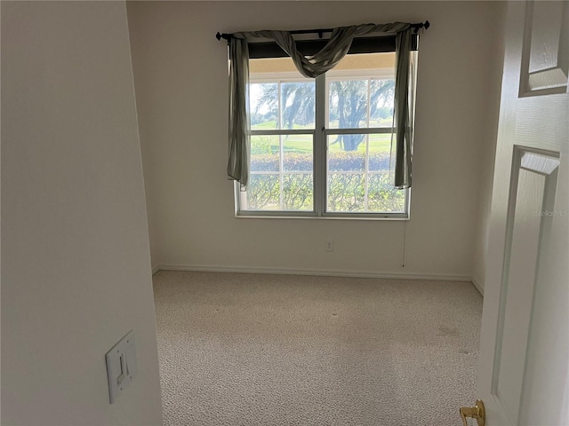 unfurnished room featuring baseboards