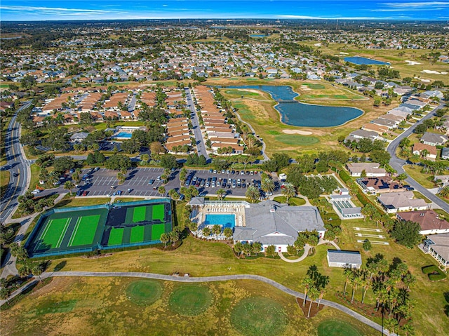 birds eye view of property with a residential view, view of golf course, and a water view