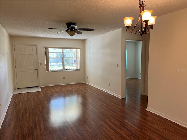 interior space with dark wood-type flooring, a textured ceiling, and ceiling fan with notable chandelier