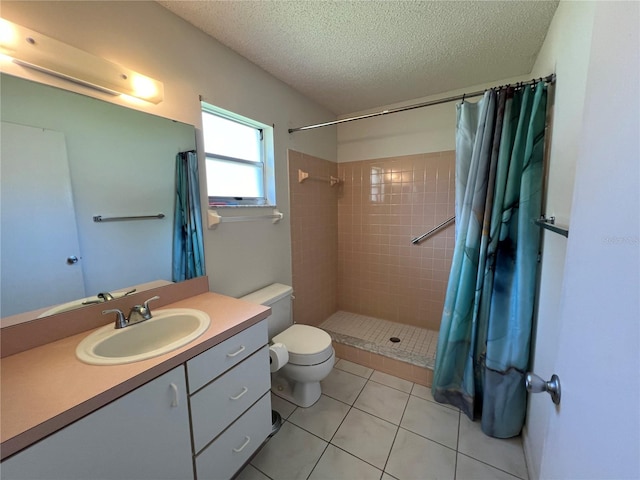 bathroom with toilet, tile patterned flooring, a shower with shower curtain, vanity, and a textured ceiling