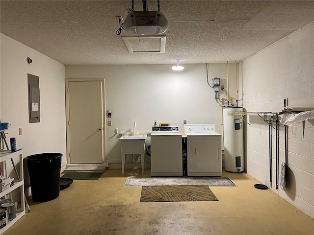 interior space featuring water heater, electric panel, a textured ceiling, and separate washer and dryer