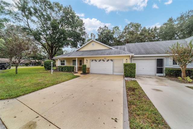 single story home with a front yard and a garage