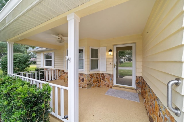 property entrance with ceiling fan