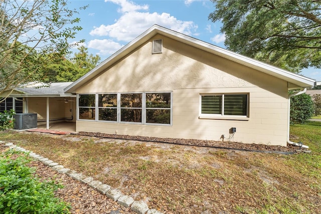 back of property with a patio and central air condition unit