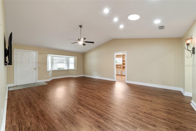 unfurnished living room featuring lofted ceiling, dark hardwood / wood-style floors, and ceiling fan