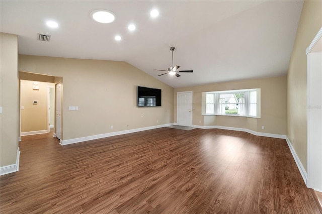 unfurnished living room featuring dark hardwood / wood-style floors, ceiling fan, and vaulted ceiling