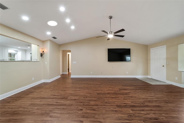 unfurnished living room with dark hardwood / wood-style flooring, vaulted ceiling, and ceiling fan