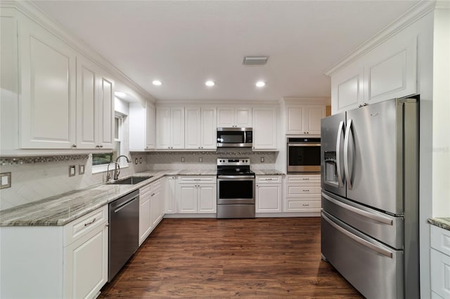 kitchen featuring white cabinetry, stainless steel appliances, and sink