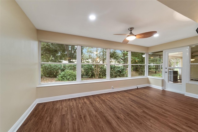 unfurnished sunroom with ceiling fan and a healthy amount of sunlight