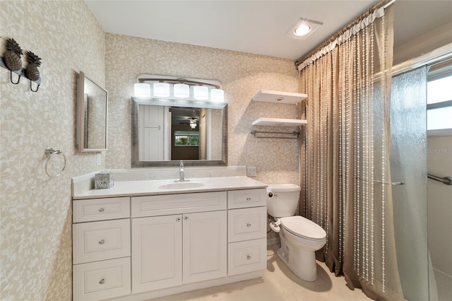 bathroom featuring walk in shower, vanity, and toilet