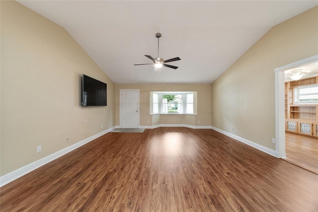 unfurnished living room with hardwood / wood-style flooring, vaulted ceiling, and ceiling fan