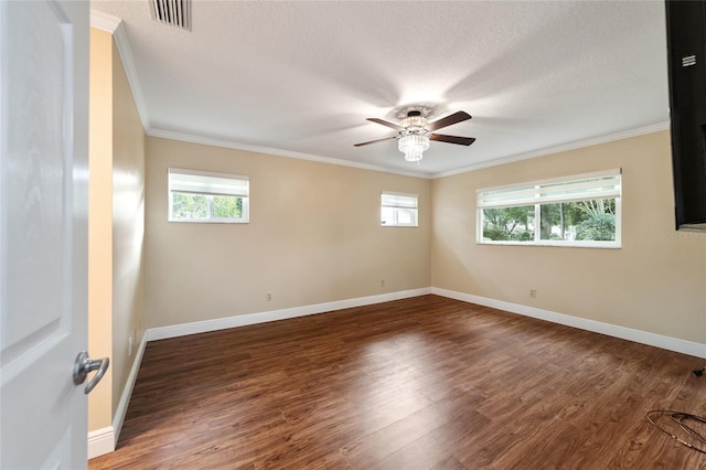 empty room with crown molding, ceiling fan, dark hardwood / wood-style flooring, and a textured ceiling